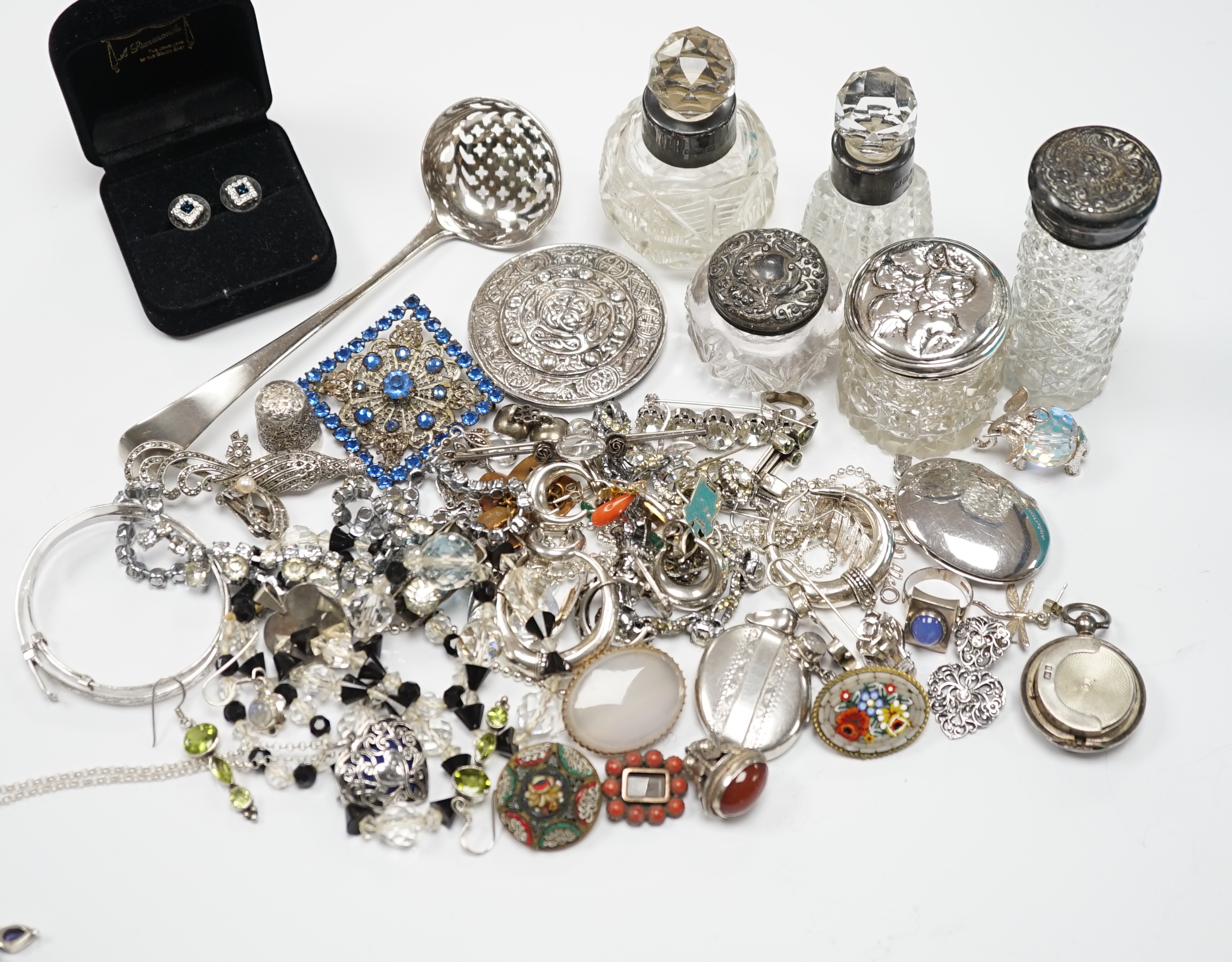 Sundry small silver including mounted glass toilet jars and a Georgian sifter spoon, together with assorted silver and other jewellery including earrings, pendants, brooches etc.